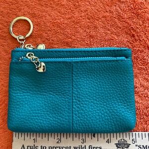 Genuine leather teal colored min coin purse or small wallet.